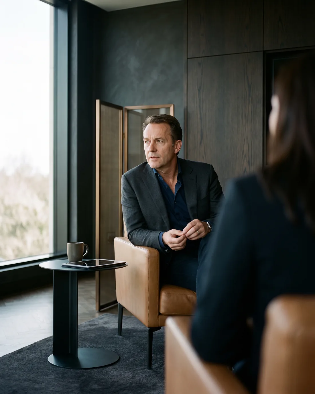 A senior CHRO reviewing the work in a calm Chicago boardroom